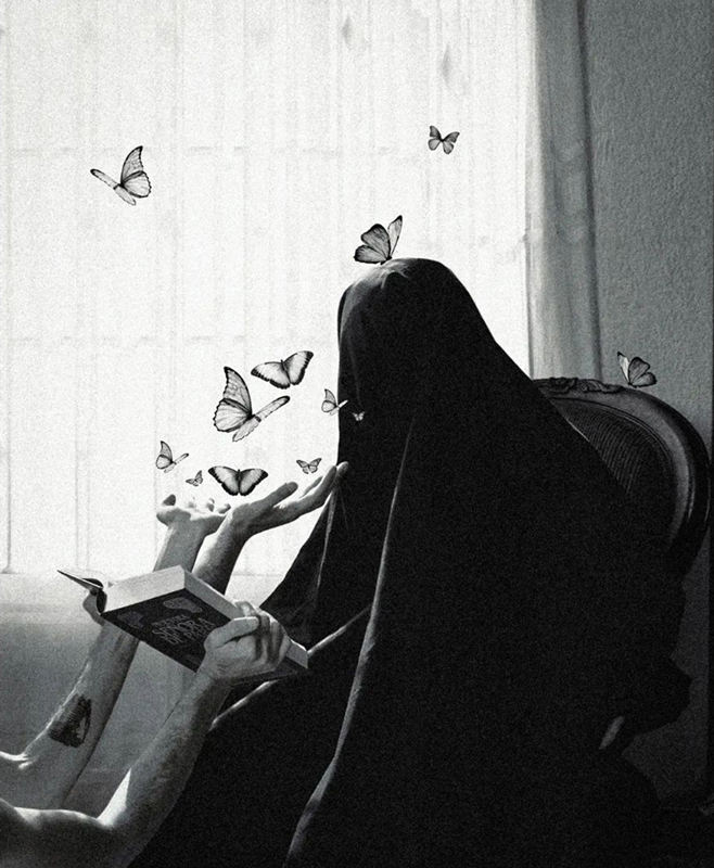 Black and white photograph of an entity covered by a robe, seated on a chair, in front of which hands hold an open book from which butterflies are emerging.